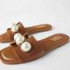 female pearl crusted summer flats